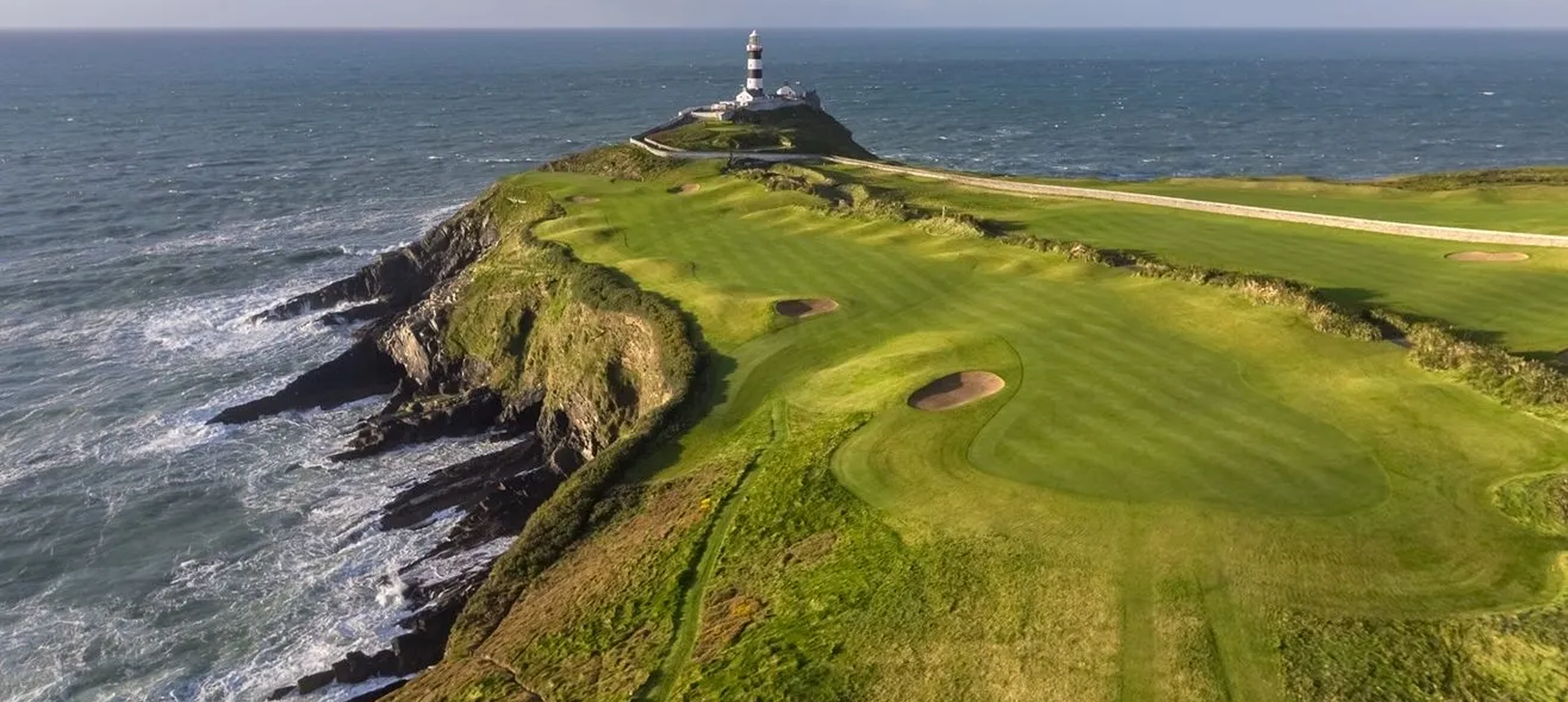 Lighthouse overlooking seaside golf course