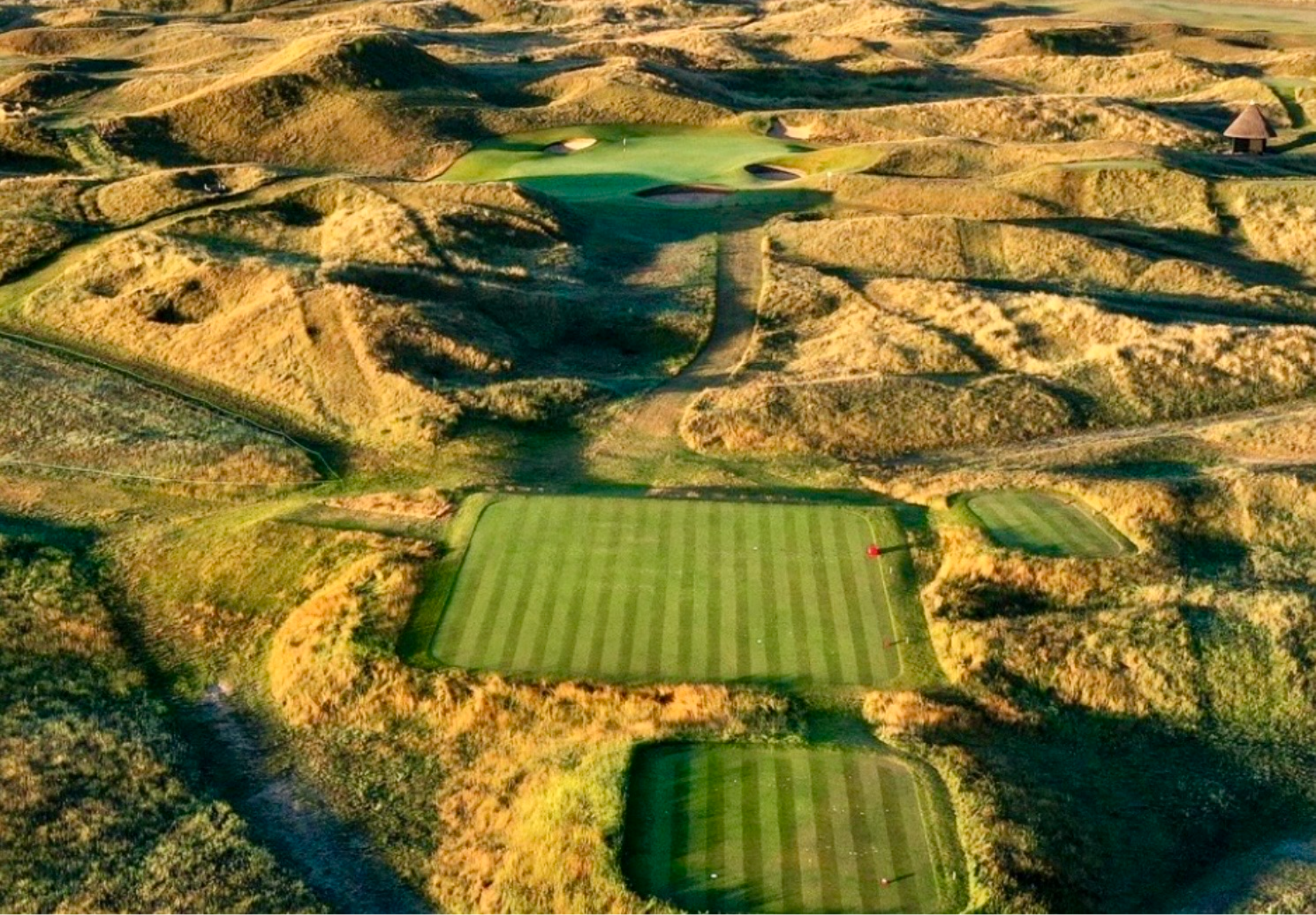 Aerial view of a golf course landscape.
