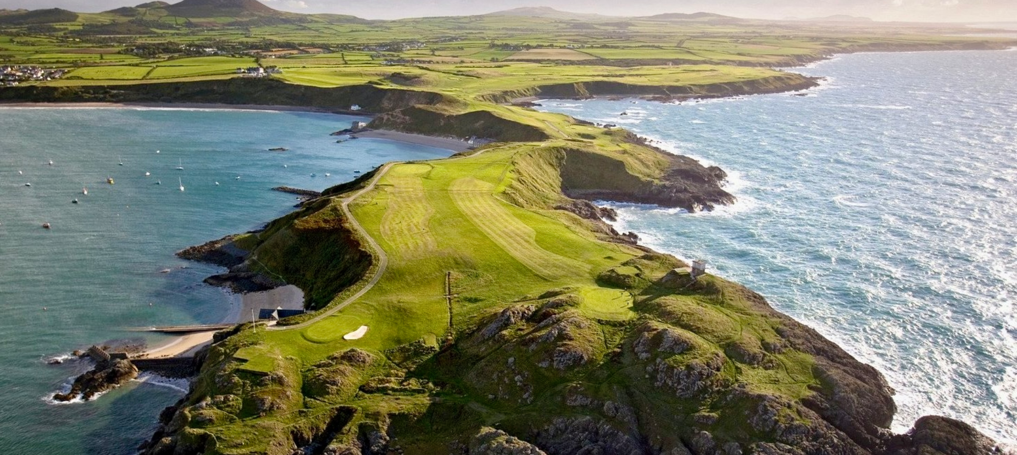 Coastal golf course with ocean view.